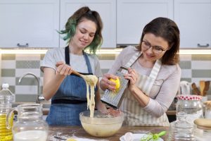 Mother and daughter cooking with CBD for their family. Buy CBD Oil in Cary