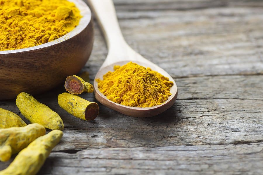 Mortar and spoon full of tumeric
