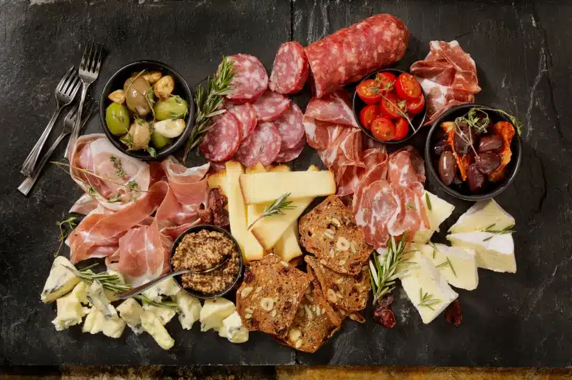 A board filled with charcuterie items